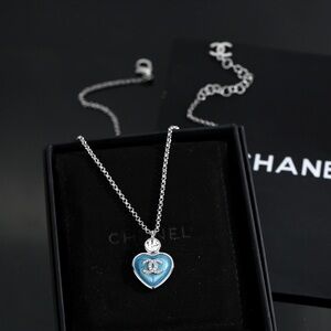 CHANEL Silver Necklace with Blue Heart Pendant